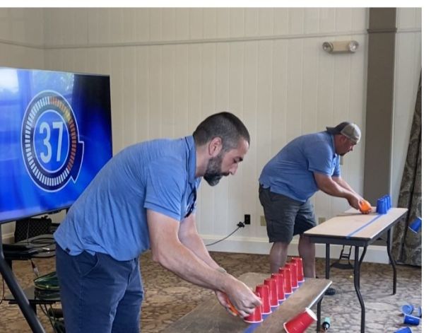 Head-to-head competition playing a Minute-to-Win-It game.