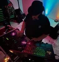 Vinny at the decks mixing some music at Sparky's Bar & Grill. - Photo Credit: Zen & Chaos